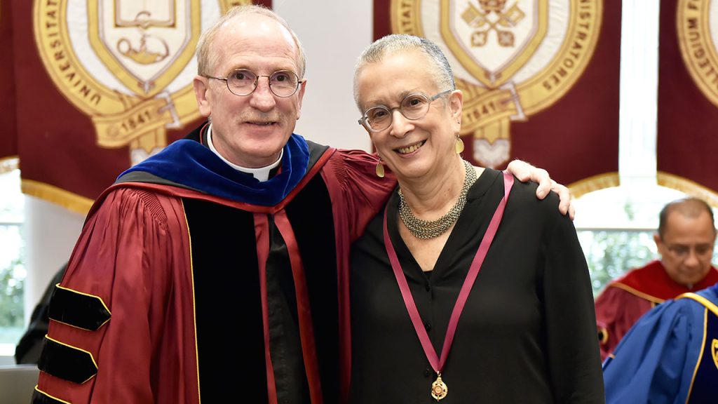 Joseph M. McShane stands next to Anne Hoffman