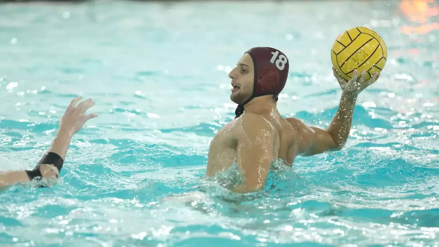 Luca Provenziani in pool throwing yellow ball