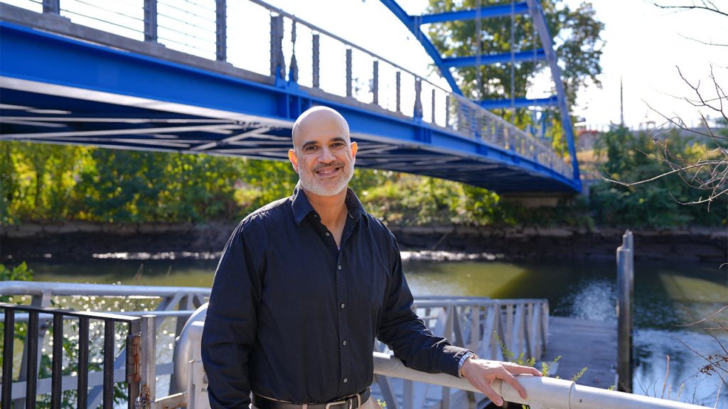 Anthony Martinez standing on the boat launch at the Bronx River's Starlight Park.