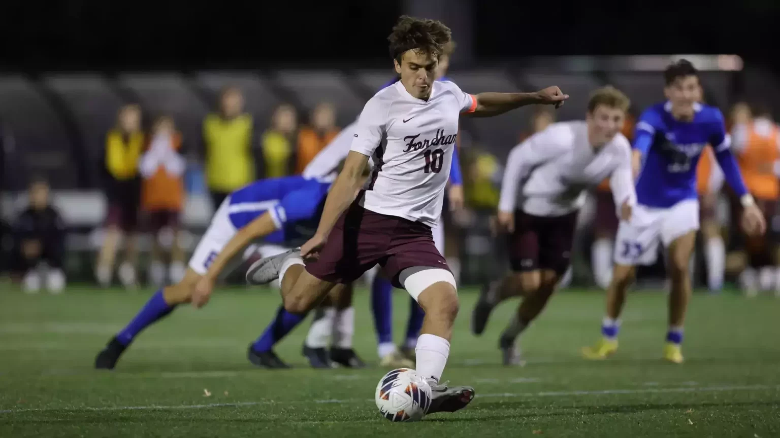 Daniel D'Ippolito, kicking soccer ball.