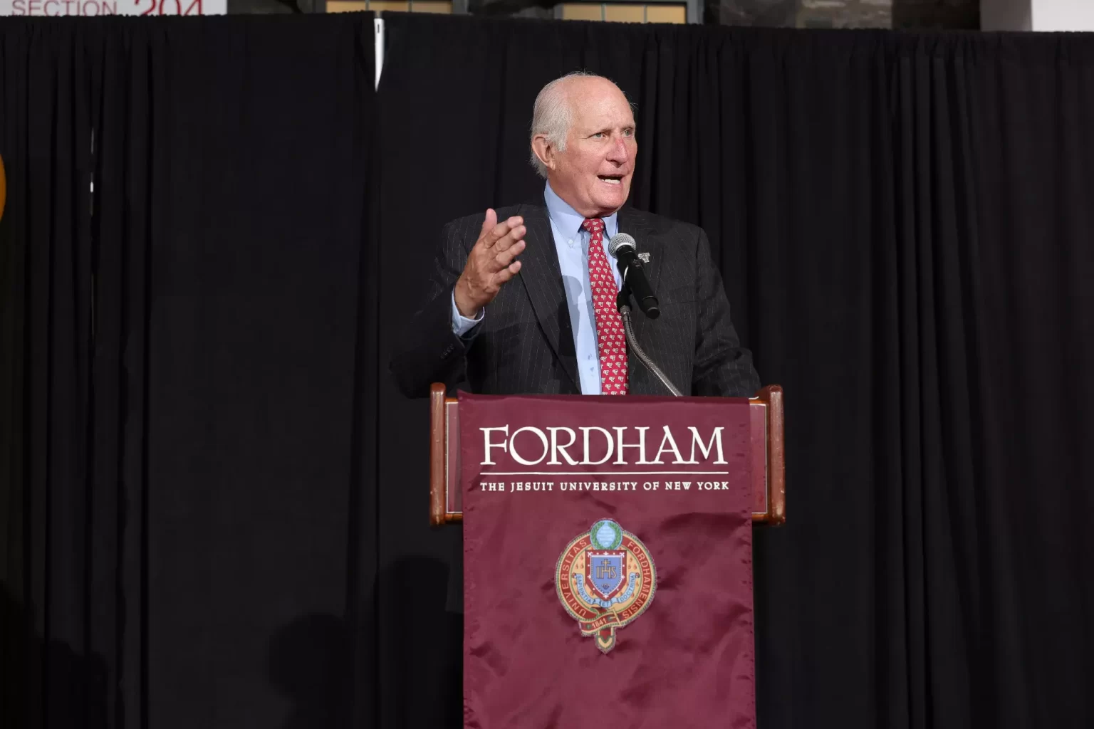 Frank McLaughlin, at podium speaking