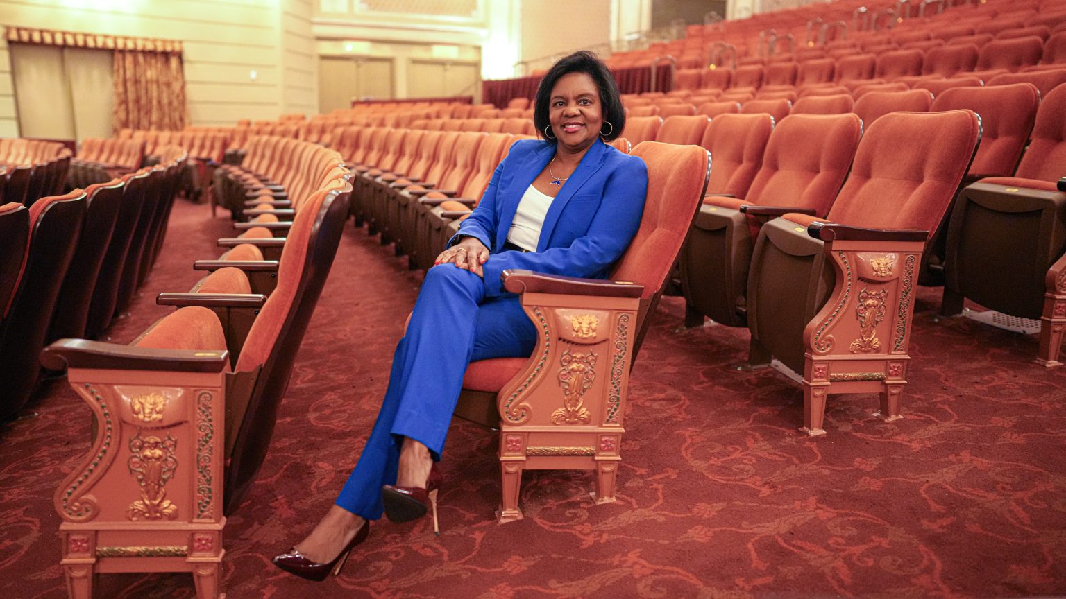 Cherine E. Anderson sits in the seats at Broadway's Majestic Theater.